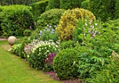 THE LASKETT GARDENS, HEREFORDSHIRE. DESIGNER ROY STRONG: MUFFS PARADE, LAWN, BORDERS, HERBACEOUS, SUMMER, JULY