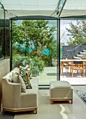 MAYFAIR PENTHOUSE GARDEN, LONDON, PLANTING ALASDAIR CAMERON: TERRACE, ROOF, CRAMBE MARITIMA, HEPTACODIUM MICONIOIDES, INSIDE OUT, CONSERVATORY, TABLE, CHAIRS, ELEAGNUS TENPIN