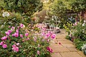 MORTON HALL, WORCESTERSHIRE: SOUTH GARDEN, PATH, FOUNTAIN, BORDERS, ROSES, ROSA OLD BLUSH CHINA, PEROVSKIA, CLEOME SPINOSA WHITE QUEEN, MORNING, DAWN, SUNRISE
