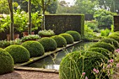 WOLLERTON OLD HALL, SHROPSHIRE: RILL, CANAL, POOL, RECTANGULAR, WATER, HEDGES, HEDGING, SUMMER, REFLECTIONS, AXIS, SYMMETRY, FOCAL, POINT, BOX, BALLS, BUXUS, CLIPPED, TOPIARY