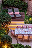 SMALL TOWN, CITY GARDEN DESGNED BY ALASDAIR CAMERON, LONDON: FORMAL, TOWN, GARDEN, NIGHT, LIGHTS, LIGHTING, STEPS, DECKING, TABLE, CHAIRS, OUTDOOR LIVING