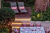 SMALL TOWN, CITY GARDEN DESGNED BY ALASDAIR CAMERON, LONDON: FORMAL, TOWN, GARDEN, NIGHT, LIGHTS, LIGHTING, STEPS, DECKING, TABLE, CHAIRS, OUTDOOR LIVING