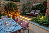 SMALL TOWN, CITY GARDEN DESGNED BY ALASDAIR CAMERON, LONDON: FORMAL, TOWN, GARDEN, NIGHT, LIGHTS, LIGHTING, STEPS, DECKING, TABLE, CHAIRS, OUTDOOR LIVING, FERNS