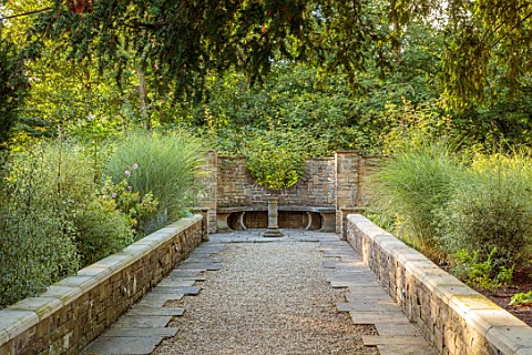 BOWCLIFFE_HALL_YORKSHIRE_DESIGN_ALISTAIR_BALDWIN_PATH_STONE_URN_CONTAINER_STONE_BENCH_SEAT_MISCANTHU