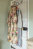 PEAR TREE COTTAGE, OXFORDSHIRE: MASTER BEDROOM, FLORAL COAT KATHRYN MADE FROM RECLAIMED VINTAGE CURTAIN FABRIC