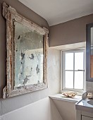 PEAR TREE COTTAGE, OXFORDSHIRE: BATHROOM, VINTAGE FOXED GLASS FRENCH MIRROR, CLAM SHELL