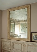 PEAR TREE COTTAGE, OXFORDSHIRE: BATHROOM, VINTAGE FRENCH PANELLED WALLS, LARGE FOXED VINTAGE GLASS FRENCH MIRROR