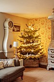 PEAR TREE COTTAGE, OXFORDSHIRE: SITTING ROOM, CHRISTMAS TREE, FRENCH BUREAU, SWEDISH MORA CLOCK, CUSHIONS