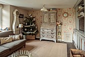 PEAR TREE COTTAGE, OXFORDSHIRE: SITTING ROOM, CHRISTMAS TREE, FRENCH BUREAU, SWEDISH MORA CLOCK, CUSHIONS, DRUM COFFEE TABLE, CANDLE RING