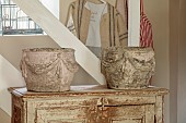 PEAR TREE COTTAGE, OXFORDSHIRE: KITCHEN, PAIR OF DECORATIVE STONE PLANTERS, VINTAGE FRENCH CABINET