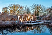 THE OLD RECTORY, QUINTON, NORTHAMPTONSHIRE: DESIGNER ANOUSHKA FEILER: GRASSES, FROST, WINTER, FROSTY GARDEN, ENGLISH, COUNTRY, CHURCH, JANUARY, WATER, POOL, POND, LAKE, DECKING