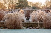 THE OLD RECTORY, QUINTON, NORTHAMPTONSHIRE: DESIGNER ANOUSHKA FEILER: GRASSES, FROST, WINTER, GARDEN, ENGLISH, COUNTRY, JANUARY, MISCANTHUS KLEINE FONTAINE, RILL, WALL, HEDGES