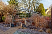 THE OLD RECTORY, QUINTON, NORTHAMPTONSHIRE: DESIGNER ANOUSHKA FEILER: FROST, FROSTY, WINTER, JANUARY, METAL PERGOLA, ARCHWAY