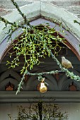 THE HYDE, HEREFORDSHIRE: JANUARY, CHRISTMAS DECORATIONS ON FRONT DOOR, BY SHANE CONNOLLY, METAL PARTRIDGE, PEARS, MISTLETOE
