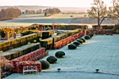 LOWER BOWDEN MANOR, BERKSHIRE: WINTER, FROST, FROSTY, JANUARY, VIEW FROM HOUSE OVER FORMAL GARDEN, LAWN, BEECH, YEW, HEDGES, HEDGING