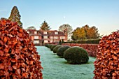 LOWER BOWDEN MANOR, BERKSHIRE: WINTER, FROST, FROSTY, JANUARY, FORMAL GARDEN, LAWN, BEECH, YEW, HEDGES, HEDGING, RILL, SCULPTURE BY LAURENCE BONNEL