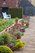 ULTING WICK, ESSEX: FORMAL SPRING GARDEN, PATH, BORDER WITH TULIPS, WHITE WOODEN BENCH, SEAT