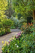 MORTON HALL, WORCESTERSHIRE: BORDER IN SOUTH GARDEN, SPRING, TULIPS, PATH