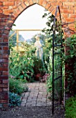 GATE INTO THE COTTAGE GARDEN FRAMING A STATUE AT WOLLERTON OLD HALL  SHROPSHIRE (AS 10764)
