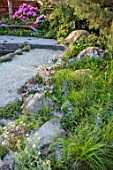 CHELSEA 2022: A SWISS SANCTUARY BY LILLY GOMM: PATH, ALPINES, ROCKS, METAL SEAT, BENCH, RHODODENDRONS