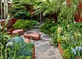 CHELSEA 2022: GARDEN DESIGNED BY KATE GOULD - GRAVEL, SEATS, PAVING, DICKSONIA, ACERS, FOLIAGE, GREEN