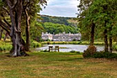 ENCOMBE HOUSE, DORSET: HOUSE, LAKE, TREES, BENCHES, WOODEN, SEATS, VIEW, FRAMES, SUMMER