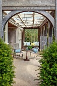 ASHBROOK HOUSE, NORTHAMPTONSHIRE: SUMMER, LOGGIA, TABLE, CHAIRS, WINDOW, CUSHIONS BY TITANIA
