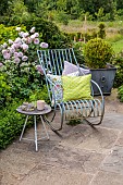 ASHBROOK HOUSE, NORTHAMPTONSHIRE: SUMMER, CHAIR, CUSHIONS BY TITANIA, PARASOL, UMBRELLA BY TITANIA, TABLE, CHAIRS, CUSHIONS, TERRACE, PATIO, ROSES