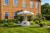 ASHBROOK HOUSE, NORTHAMPTONSHIRE: SUMMER, PARASOL, UMBRELLA BY TITANIA, LAWN, TABLE, CHAIRS, ENTERTAINING