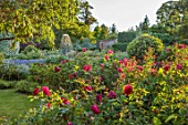 BORDE HILL GARDEN, WEST SUSSEX: JAY ROBINS ROSE GARDEN, JUNE, FOUNTAIN OF APHRODITE BY BRENDON MURLESS, RED ROSES, WALLED GARDEN