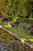 THE SUMMERHOUSE, OXFORDSHIRE: JULY, SUMMER, CANAL, POND, POOL, WATER, GARDEN, BORDERS, TREES, WATERLILIES, STONE, DOVECOTE, STEPS, URNS, CONTAINERS, LAWN, PEROVSKIA