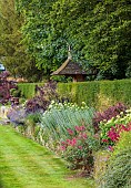 THE SUMMERHOUSE, OXFORDSHIRE: JULY, SUMMER, GARDEN, BORDERS, TREES, STONE DOVECOTE, YEW HEDGES, HEDGING, PEROVSKIA, COTSWOLDS