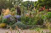 HIGHLANDS, SUSSEX: SUMMER, BORDERS, RED HOT POKERS, KNIPHOFIA, PEROVSKIA, STIPA GIGANTEA, LAVATERA, VERBASCUMS, CLEMATIS