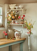 GREEN AND GORGEOUS FLOWERS, OXFORDSHIRE: CORNER OF FLOWER ROOM, JUGS, CONTAINERS, CHRYSANTHEMUM SALMON ALLOUISE, ANEMONE WHIRLWIND, ICELAND