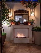 SMALL LONDON GARDEN DESIGNED BY ALASDAIR CAMERON: BASEMENT, PATIO, TOWN, URBAN, CONTEMPORARY, LIGHTS, LIGHTING, EVENING, NIGHT, OUTDOOR FIREPLACE, MIRROR, CONTAINERS