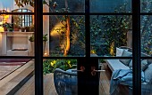 SMALL LONDON GARDEN DESIGNED BY ALASDAIR CAMERON: BASEMENT, PATIO, TOWN, URBAN, CONTEMPORARY, LIGHTS, LIGHTING, EVENING, NIGHT, OUTDOOR FIREPLACE, MIRROR, CONTAINERS