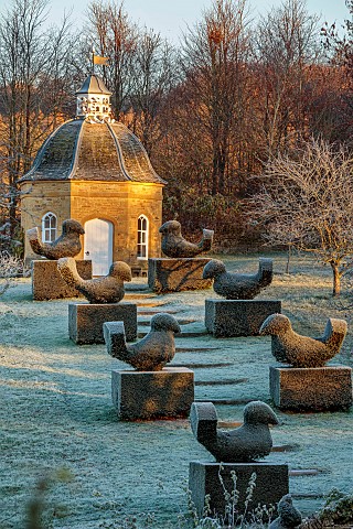 ROCKCLIFFE_GARDEN_GLOUCESTERSHIRE_CLIPPED_TOPIARY_YEW_BIRDS_DOVECOTE_BUILDING_ORCHARD_FROST_FROSTY_S