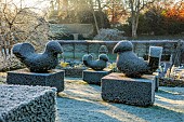 ROCKCLIFFE GARDEN, GLOUCESTERSHIRE: SUNRISE, ENGLISH, COUNTRY, GARDEN, WINTER, FROST, SUNRISE, CLIPPED TOPIARY BIRDS, FROSTY