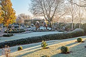 ORDNANCE HOUSE, WILTSHIRE: FROST, FROSTY, WINTER, PORTUGUESE LAUREL HEDGE, HEDGING, SUMMERHOUSE, PYRUS CHANTICLEER, FORMAL, COUNTRY, GARDEN