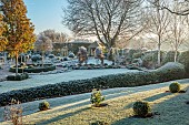 ORDNANCE HOUSE, WILTSHIRE: FROST, FROSTY, WINTER, PORTUGUESE LAUREL HEDGE, HEDGING, SUMMERHOUSE, PYRUS CHANTICLEER, FORMAL, COUNTRY, GARDEN