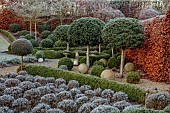 ORDNANCE HOUSE, WILTSHIRE: FROST, FROSTY, WINTER, HEDGES, HEDGING, CLIPPED TOPIARY STANDARDS, PORTUGUESE LAUREL, PRIVET, FORMAL, COUNTRY, GARDEN, LAVENDER, STONE BALLS, BEECH