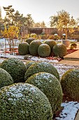 MORTON HALL GARDENS, WORCESTERSHIRE: PATH, CLIPPED TOPIARY BOX, BUXUS, SOUTH GARDEN, FORMAL, WINTER, SNOW, FROST, WALLS