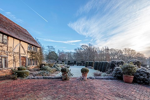 LONG_BARN_GARDENS_KENT_FROST_WINTER_HOUSE_TERRACE_CONTAINERS_LAWN_AVENUE_OF_IRISH_YEWS_CLIPPED_TOPIA