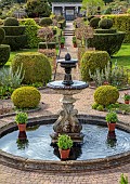THE LASKETT, HEREFORDSHIRE: APRIL, FOUNTAIN COURT, FOUNTAIN, WATER, PATH, CLIPPED TOPIARY SHAPES, LAWNS, PATH TO COLONNADE COURT