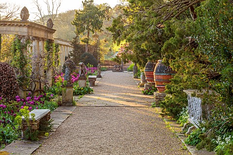 IFORD_MANOR_WILTSHIRE_APRIL_SUNSET_TERRACE_CLASSICAL_GARDEN_URNS_POTS_CONTAINERS_TULIPS_ITALIANATE_D