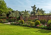 MORTON HALL GARDENS, WORCESTERSHIRE: MAY, SPRING, COUNTRY, GARDEN, SOUTH GARDEN, BORDER, TULIPS, LAWN, PYRUS SILVER SAILS, WALLS, WALLED
