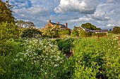 SILVER STREET FARM, DEVON: THE HOUSE, MAY, SPRING, COW PARSLEY, ANTHRISCUS SYLVESTRIS, STREAM