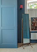 PRIVATE GARDEN, DEDHAM VALE, SUFFOLK: DRESSING ROOM PAINTED IN BLUE BLOOD BY PAINT LIBRARY, FREESTANDING CHEVALIER MIRROR BY FRENCH LOFT