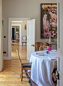 PRIVATE GARDEN, DEDHAM VALE, SUFFOLK: DINING ROOM LOOKING THROUGH THE HALLWAY TO THE SITTING ROOM, PAINTING BY MANDY RACINE, PARQUET FLOOR