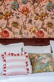 PRIVATE GARDEN, DEDHAM VALE, SUFFOLK: GUEST BEDROOM, PILLOWS, CUSHIONS, PANEL PAPERED IN ARTEMIS IN BLUSH BY HOUSE OF HACKNEY